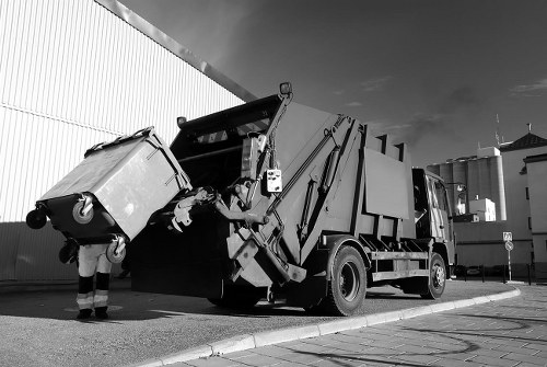 Business professionals discussing waste removal strategies in Aldgate