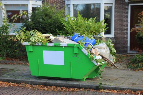 Mid-size café refit waste being sorted into recycling bins